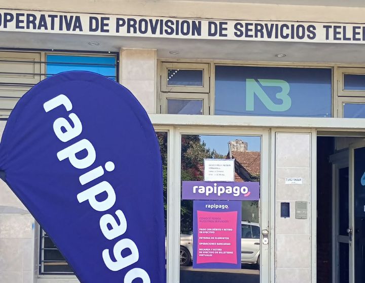 Entrada de la cooperativa, punto de pago Rapipago